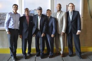 A group of men in suits posing for a photo.