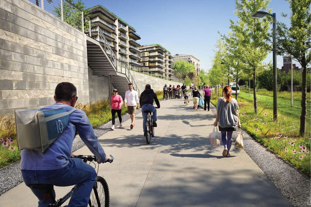 A group of people riding bikes on a sidewalk.