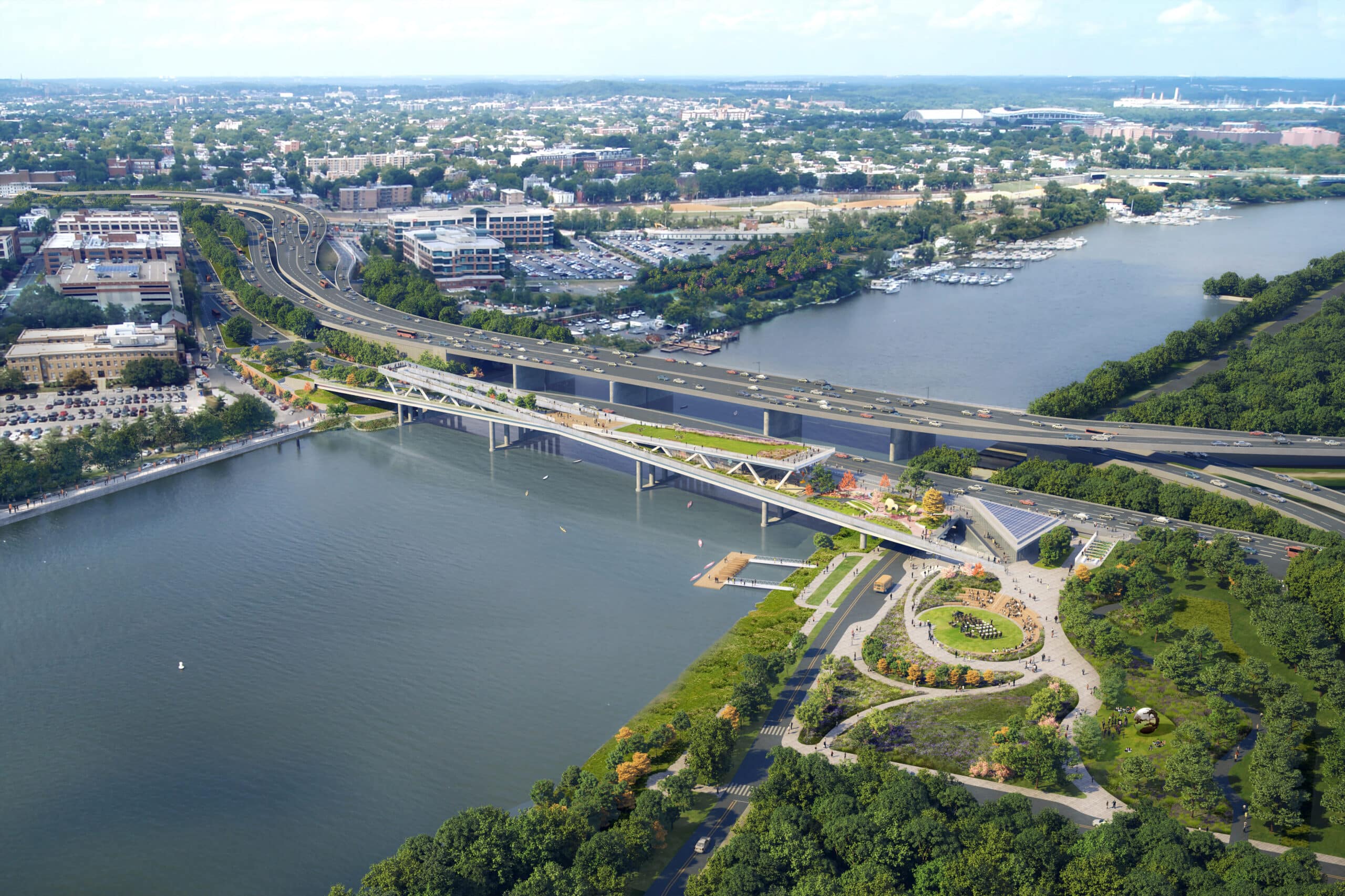 An aerial view of a bridge over a river, with the latest updates on the 11th Street Bridge Park project.