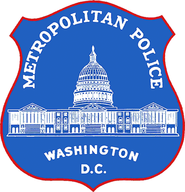 Metropolitan Police Department badge featuring the U.S. Capitol building and labeled "Metropolitan Police Washington D.C." on a blue shield.