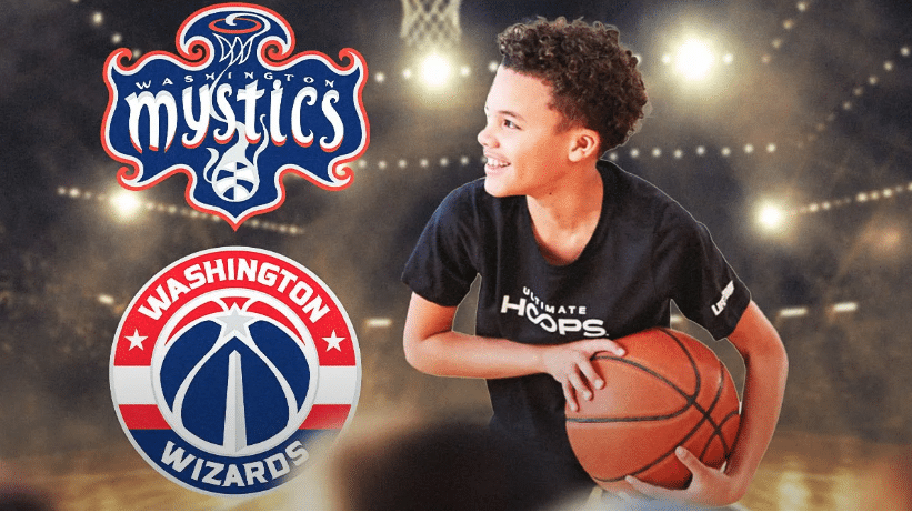 A smiling child holds a basketball in front of the Washington Mystics and Washington Wizards logos, with a blurred basketball court background.